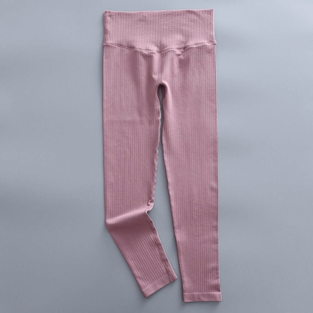 Pink sports seamless high waist ribbed leggings for women, ideal for yoga and exercise, featuring comfortable lightweight design. Model SF0163